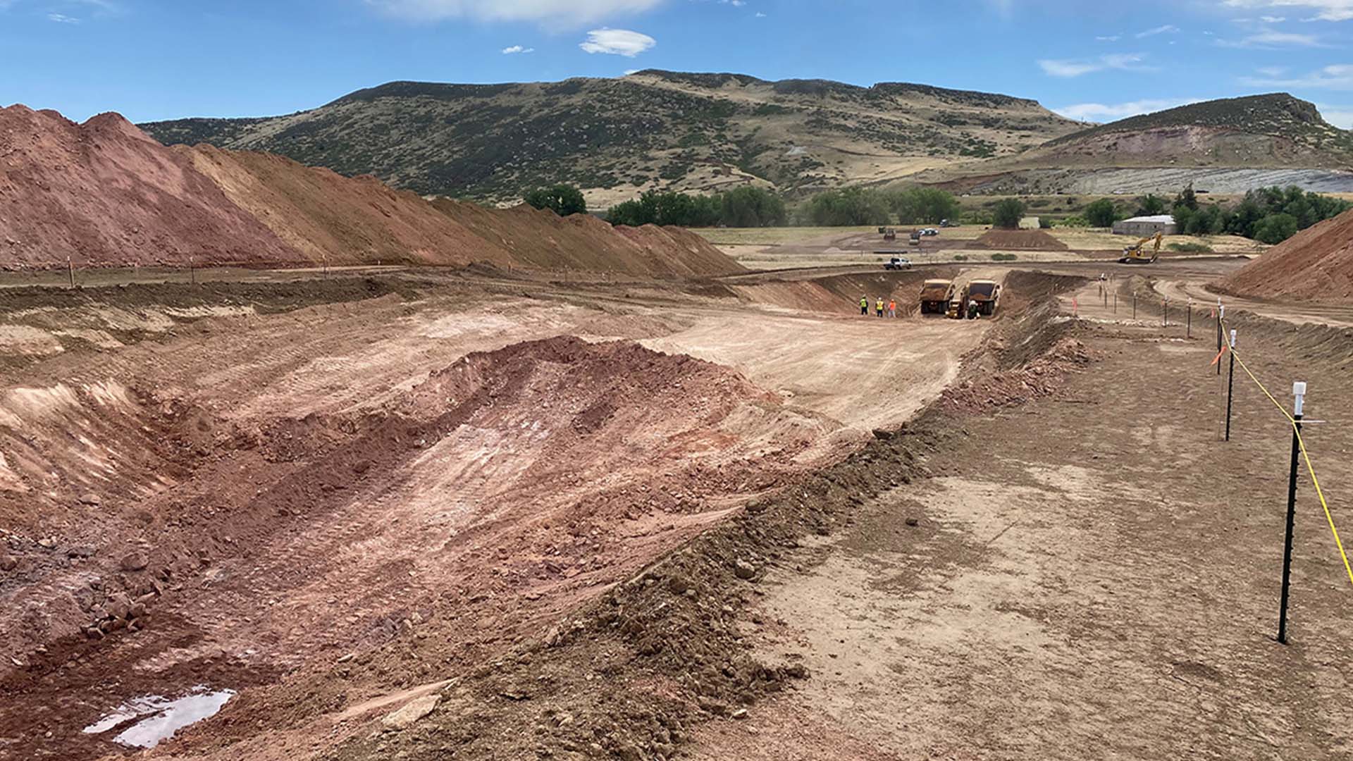 Equipment moving dirt to conduct soil studies.
