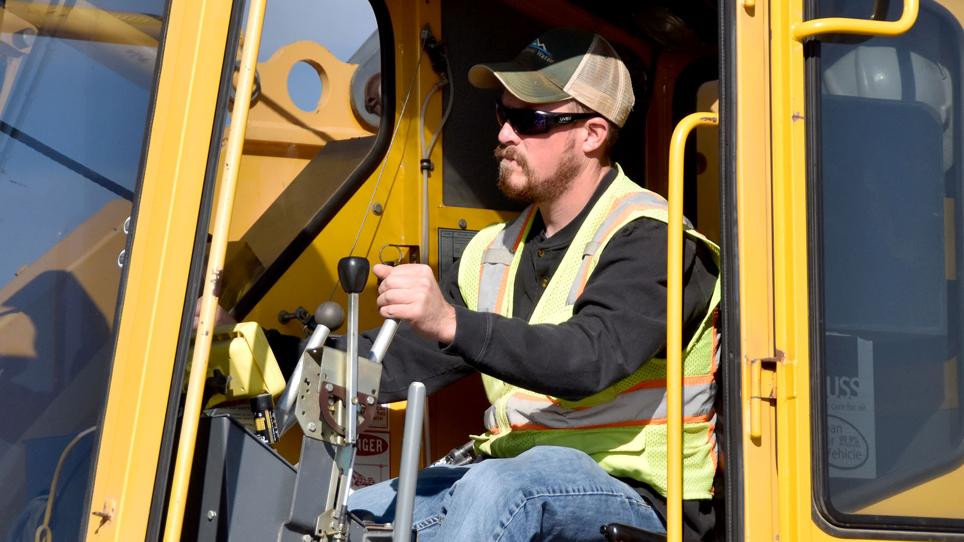 Man driver a loader doing construction.