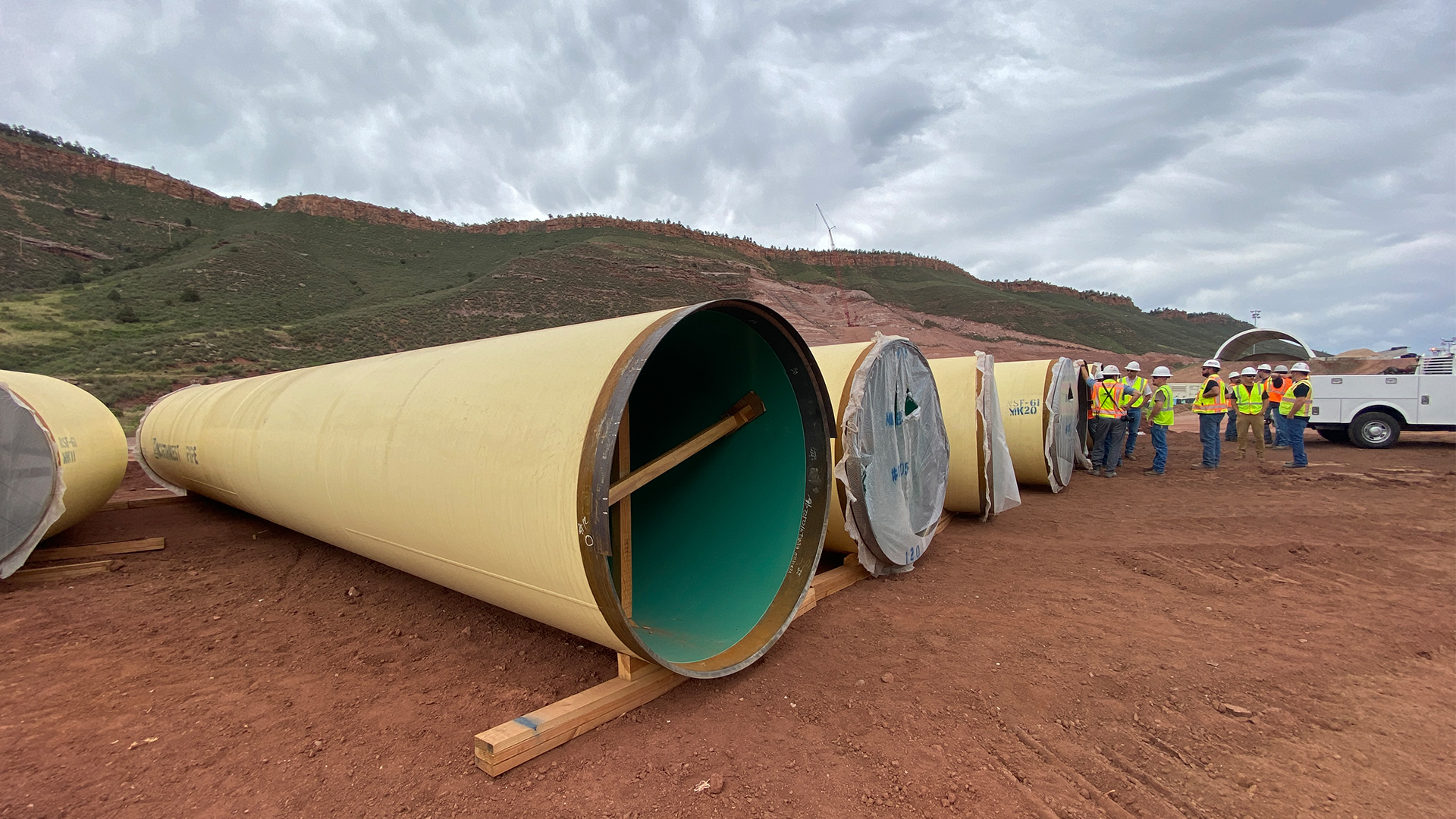 Multiple 40-foot sections of the Chimney Hollow Conduit sit waiting for installation.