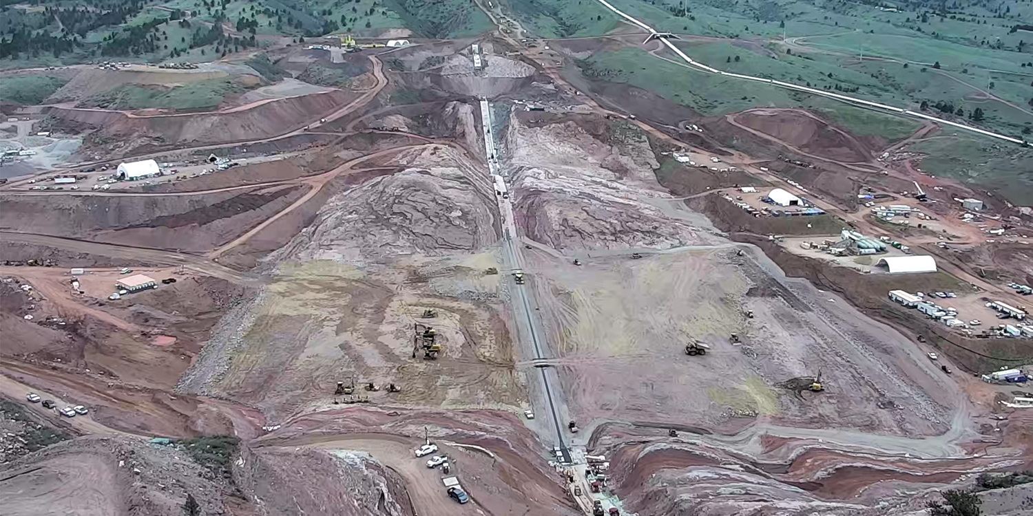 View from the Chimney Hollow Overlook of crews placing embankment material.