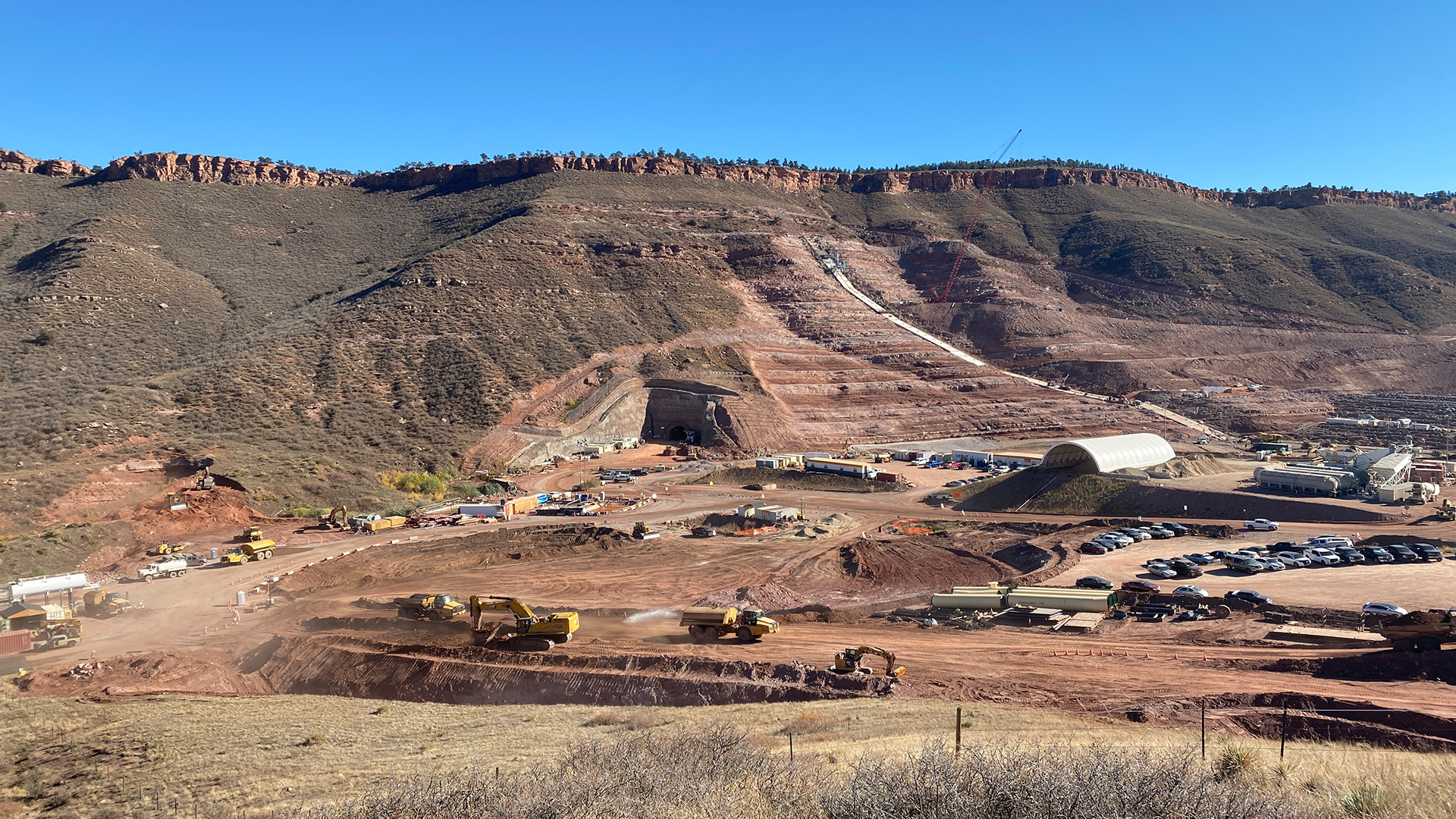 View looking south toward downstream tunnel entrance and main dam.