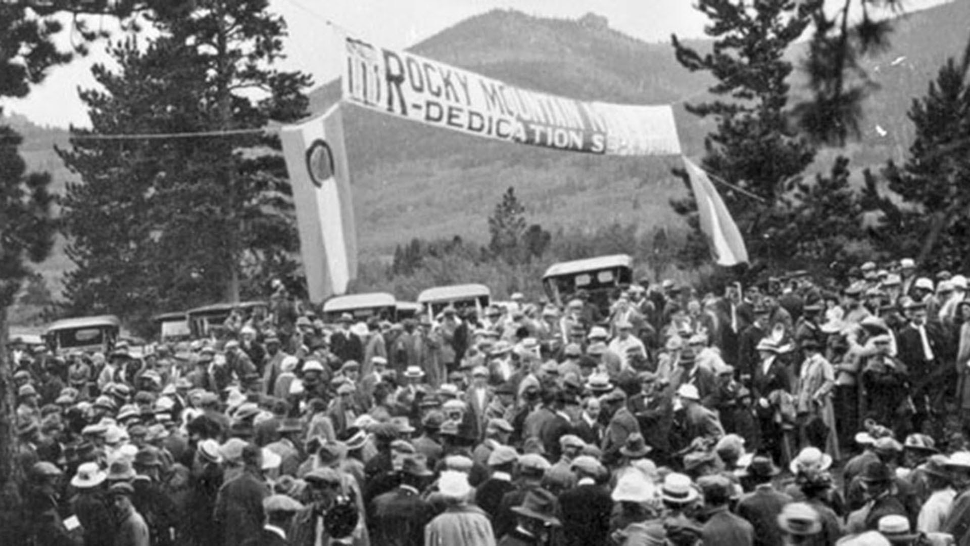 Crowds of people gather for the opening of Rocky Mountain National Park in 1915.