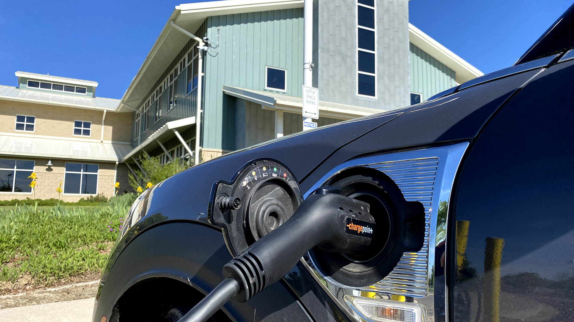 Electric car charging station, pump in car