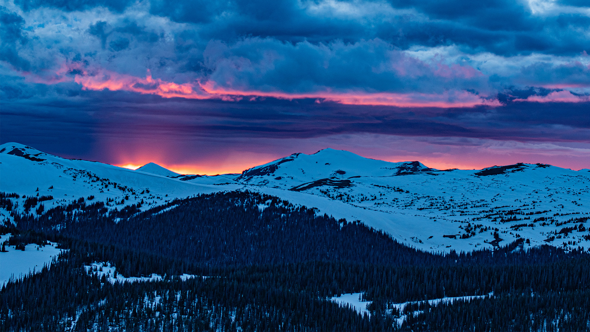 Snowy sunset over the mountains