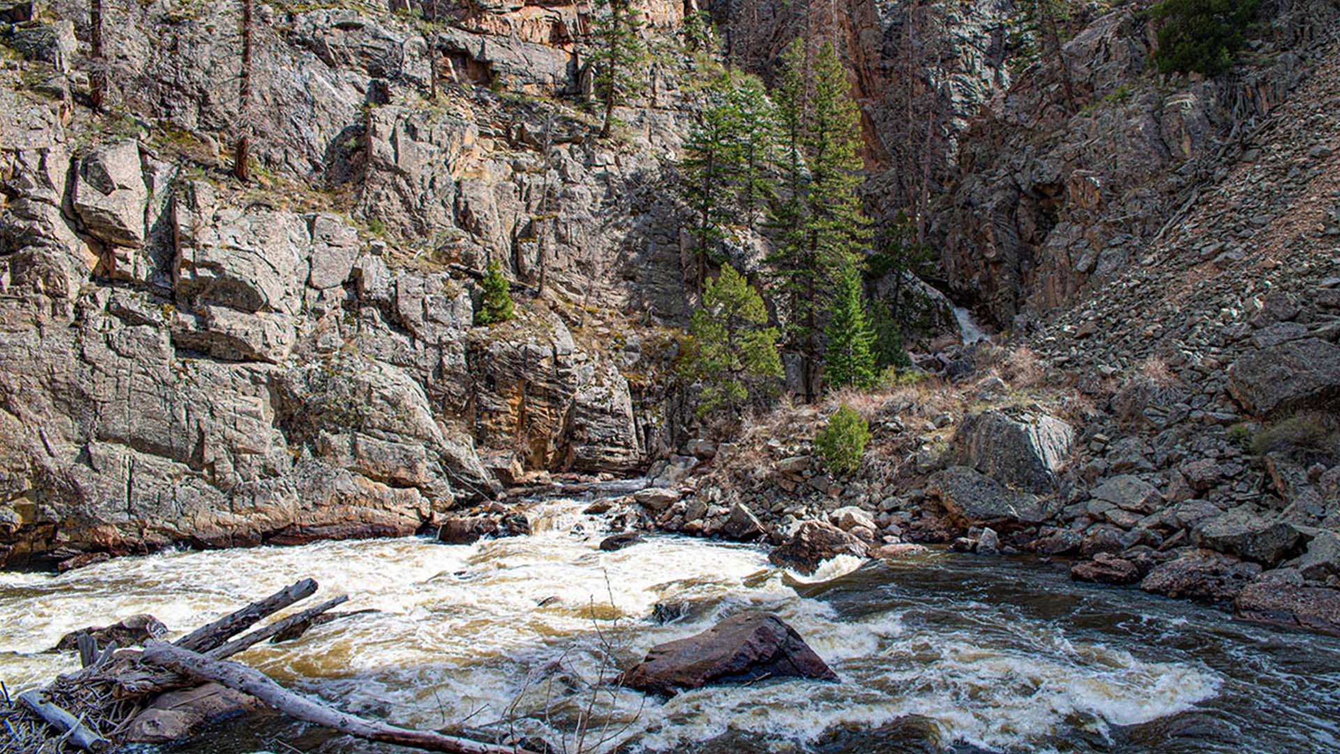 Poudre River surrounding by tall rock walls.
