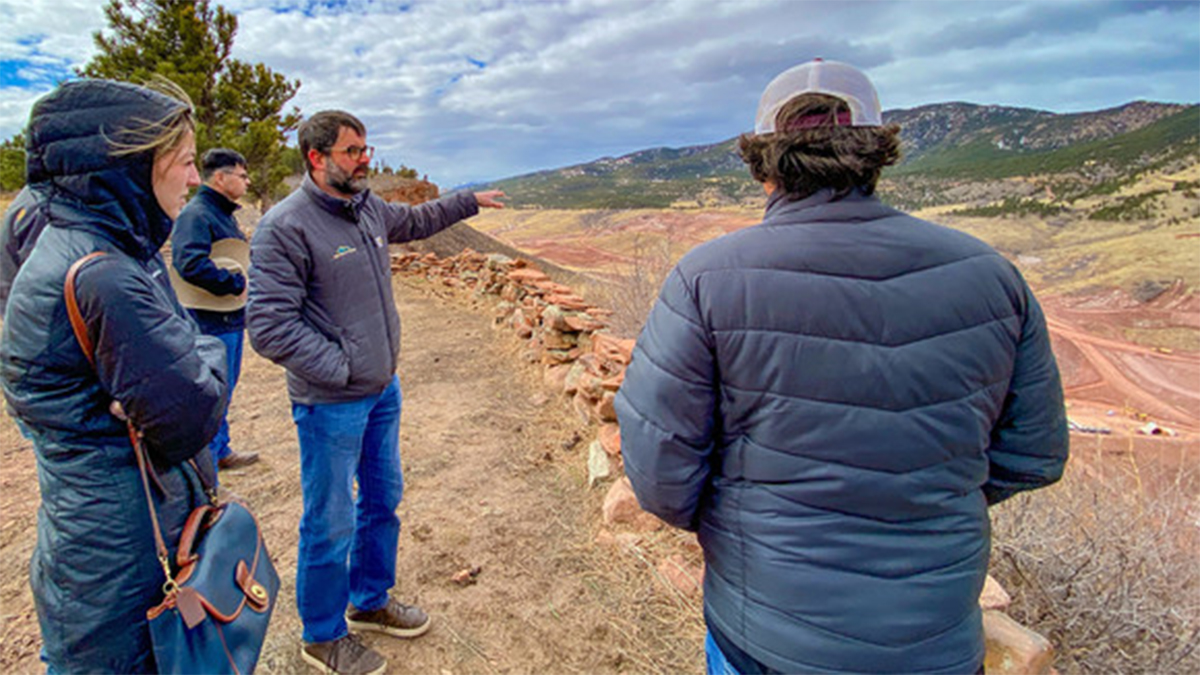 Project Manager Joe Donnelly showing the construction site to a group from the Overlook on the east ridge of the valley.