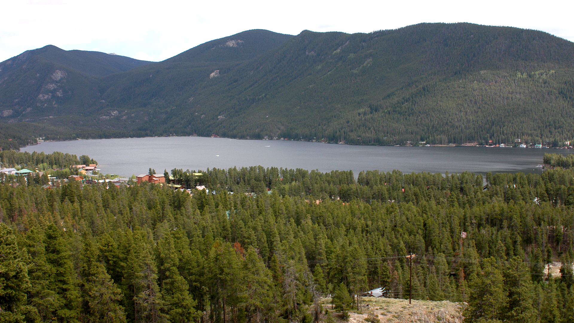 Heavy forested trees surrounding Grand Lake
