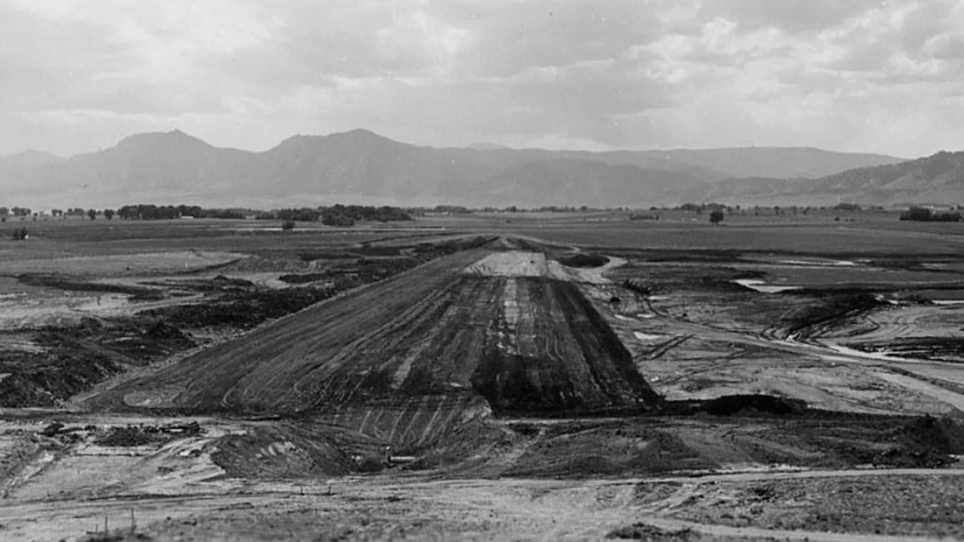 Dirt in a row building the dam at Boulder Reservoir.