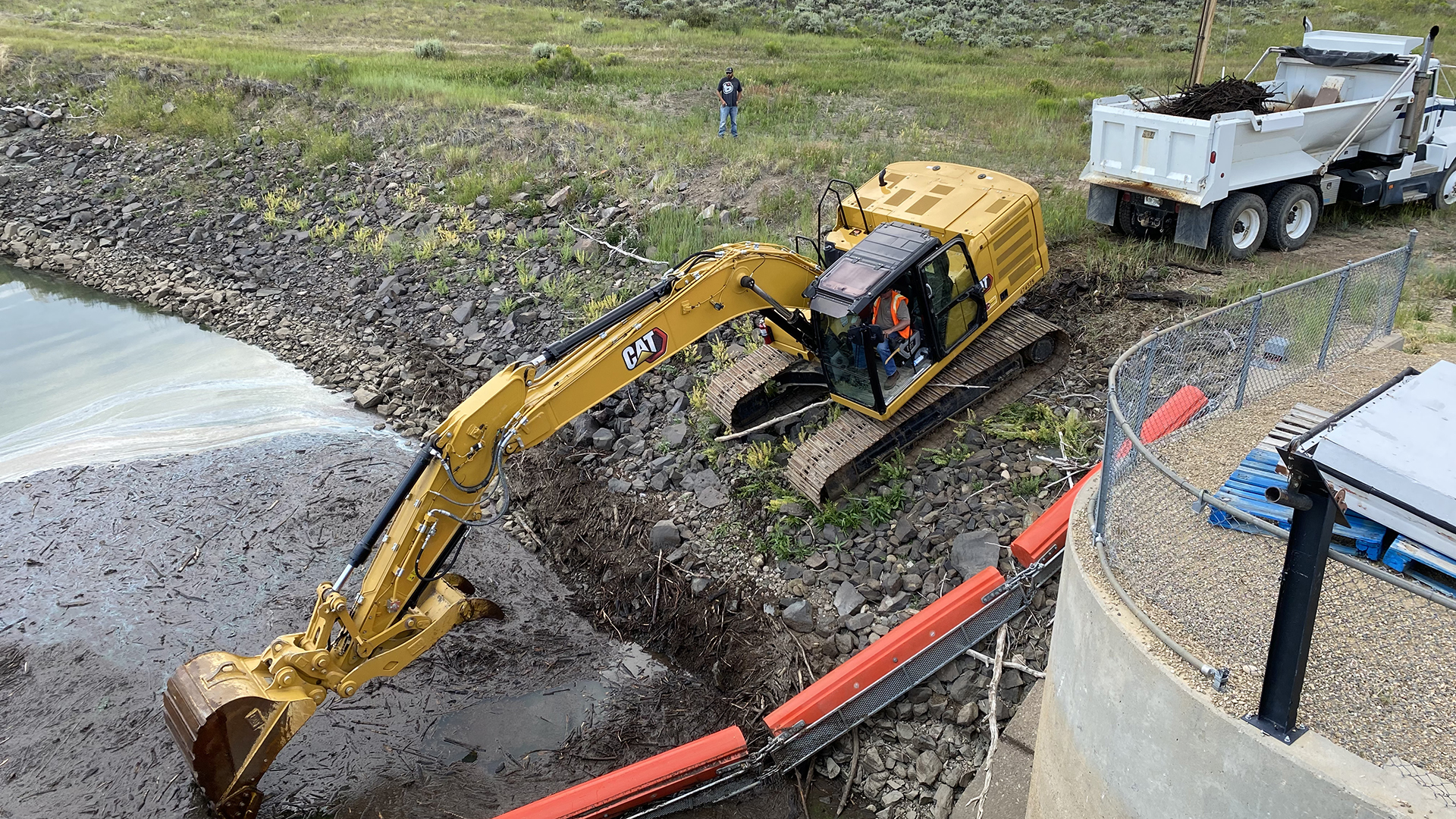 Cleanup by the Willow Creek Reservoir debris boom. 