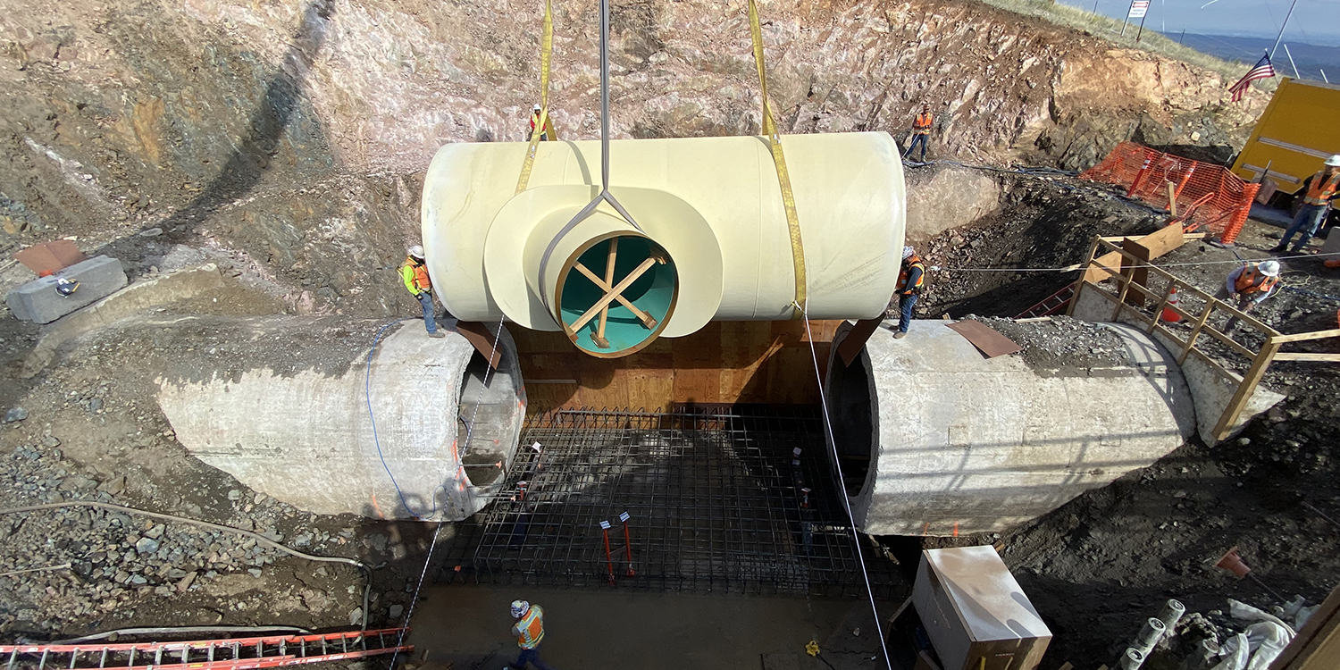 Crews placing the wye in place at the Bald Mountain Interconnect that will allow water to be diverted into Chimney Hollow Reservoir.