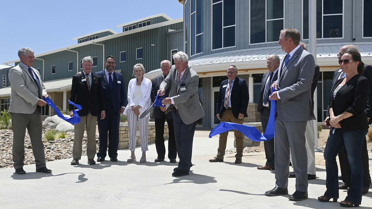 Northern Water Board President cuts a ribbon for building dedication