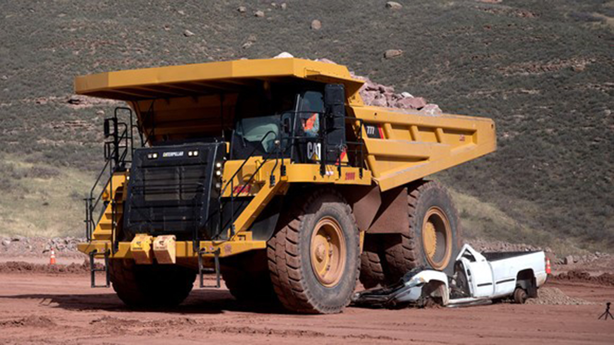 Safety demonstration on site where a 100-ton haul truck ran over a full-size pick up truck and crushed it flat.