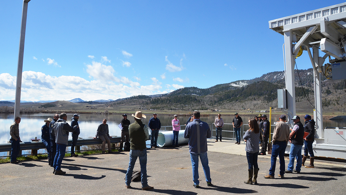 Group of people listening to presentation at Windy Gap Reservoir.