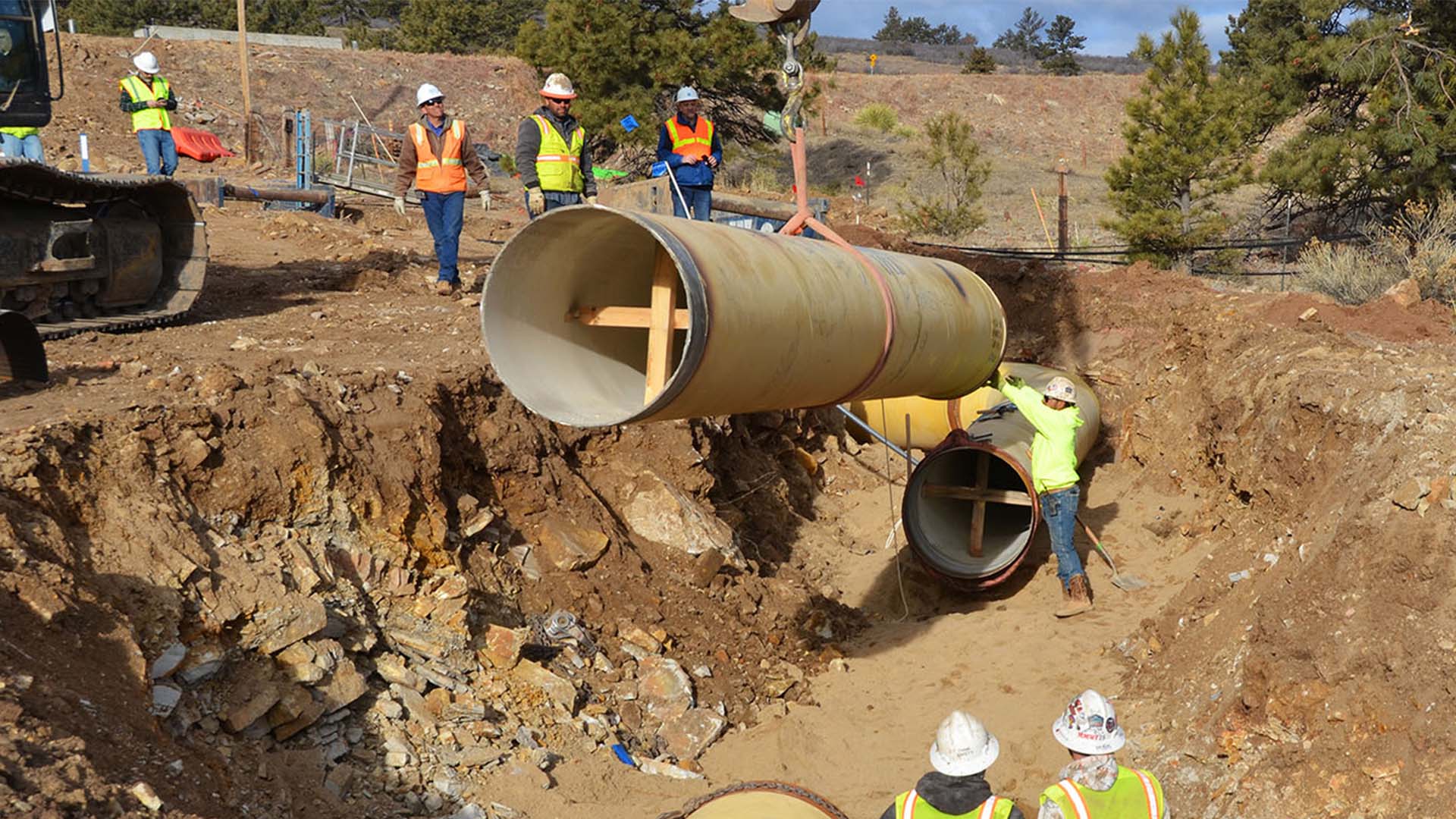 Crews lay the last pipe on the Southern Water Supply Pipeline in February 2020.