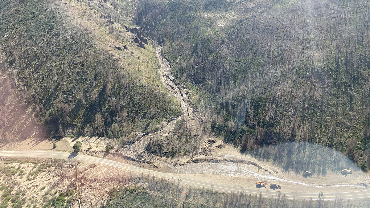 This aerial shot shows one of the many drainages where debris has been piling up before being washed out onto Highway 125.