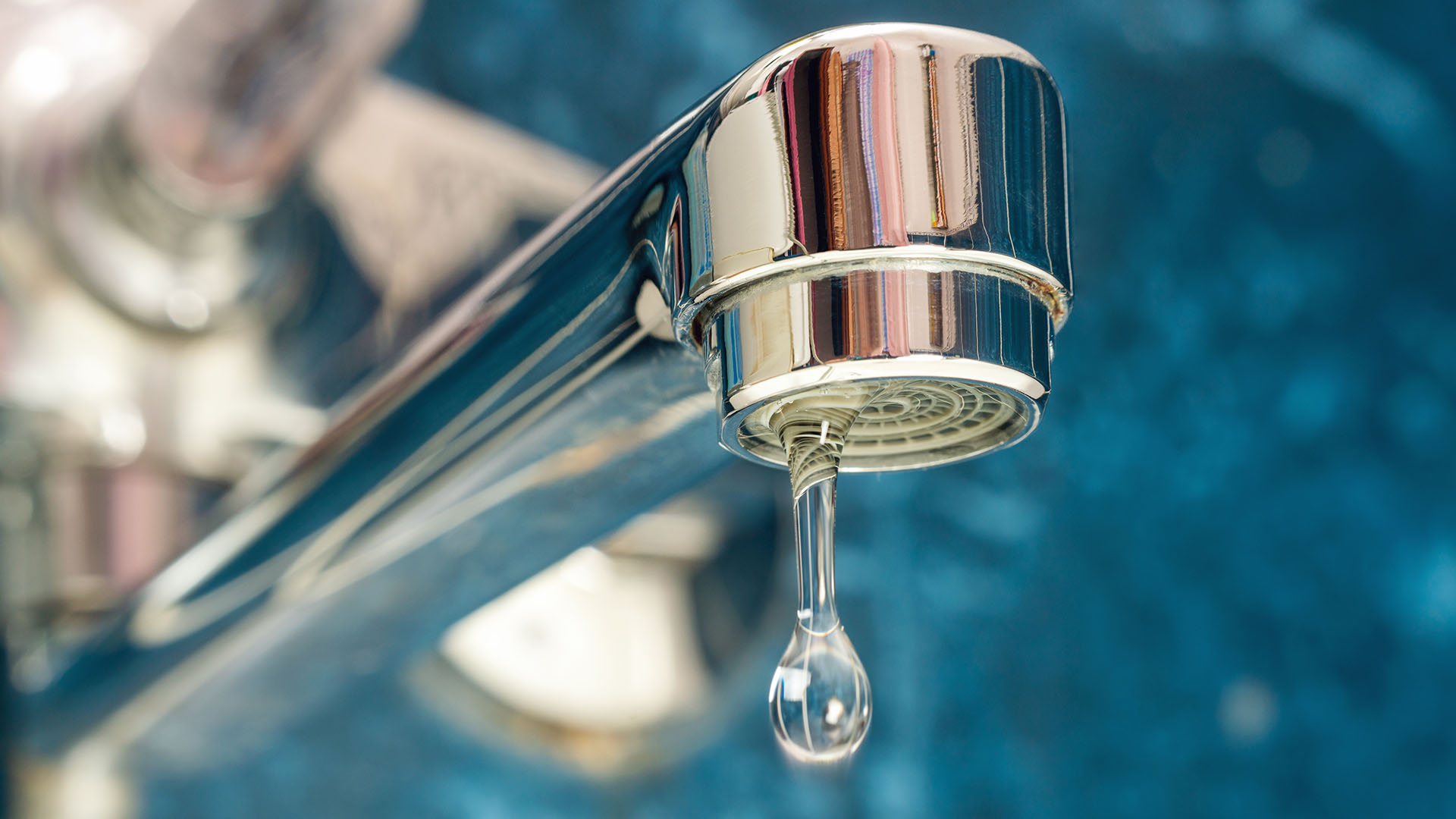 Water dripping from a faucet.