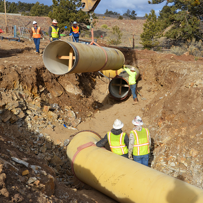 Crews placing the last piece of pipe on the Southern Water Supply Project 2 in 2020.