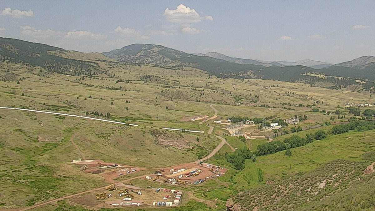 Pre-construction view of the Chimney Hollow valley shows relatively undisturbed, green valley.