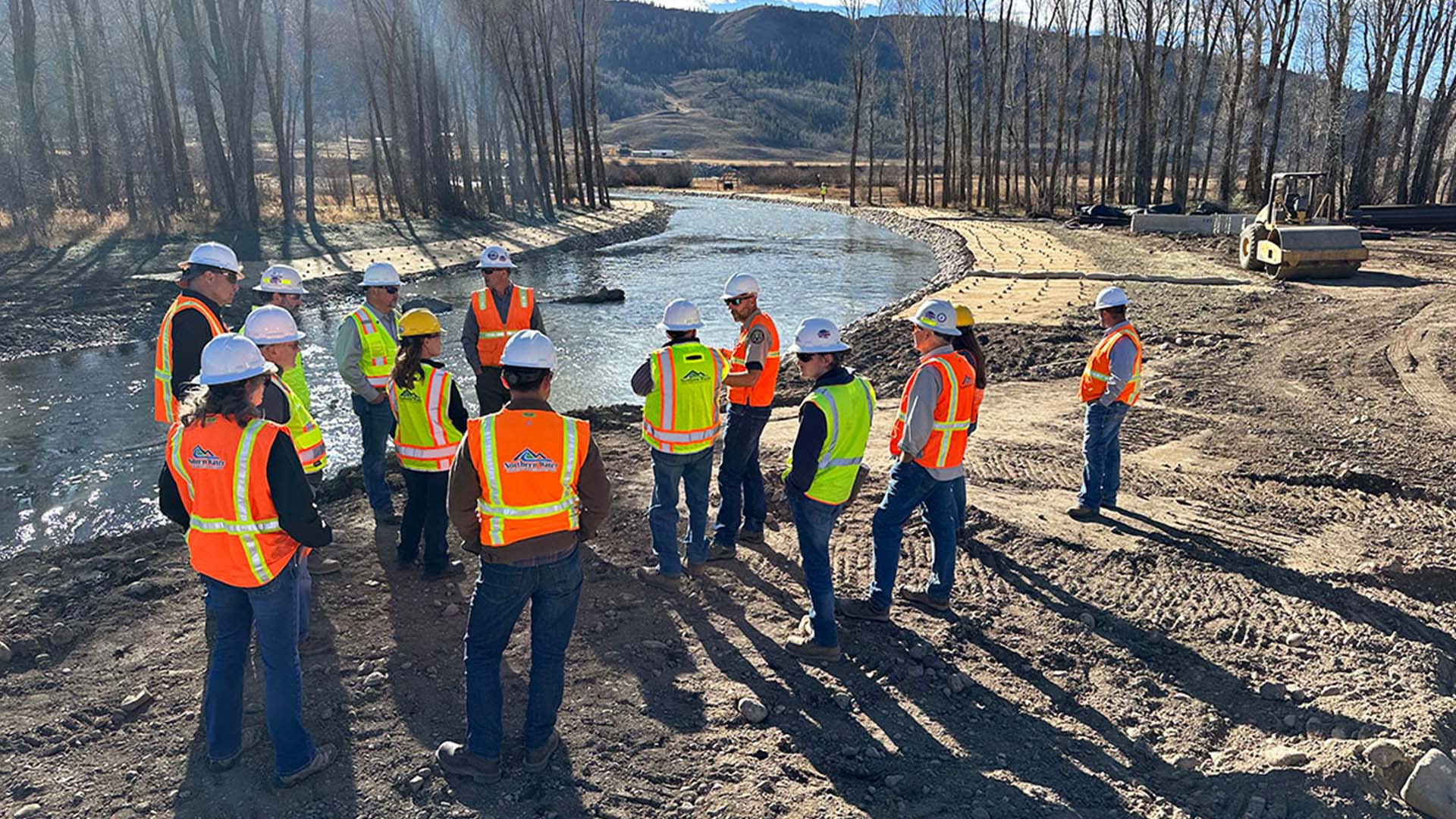 People in high visible vests monitoring the first flows through the Colorado River Connectivity Channel.