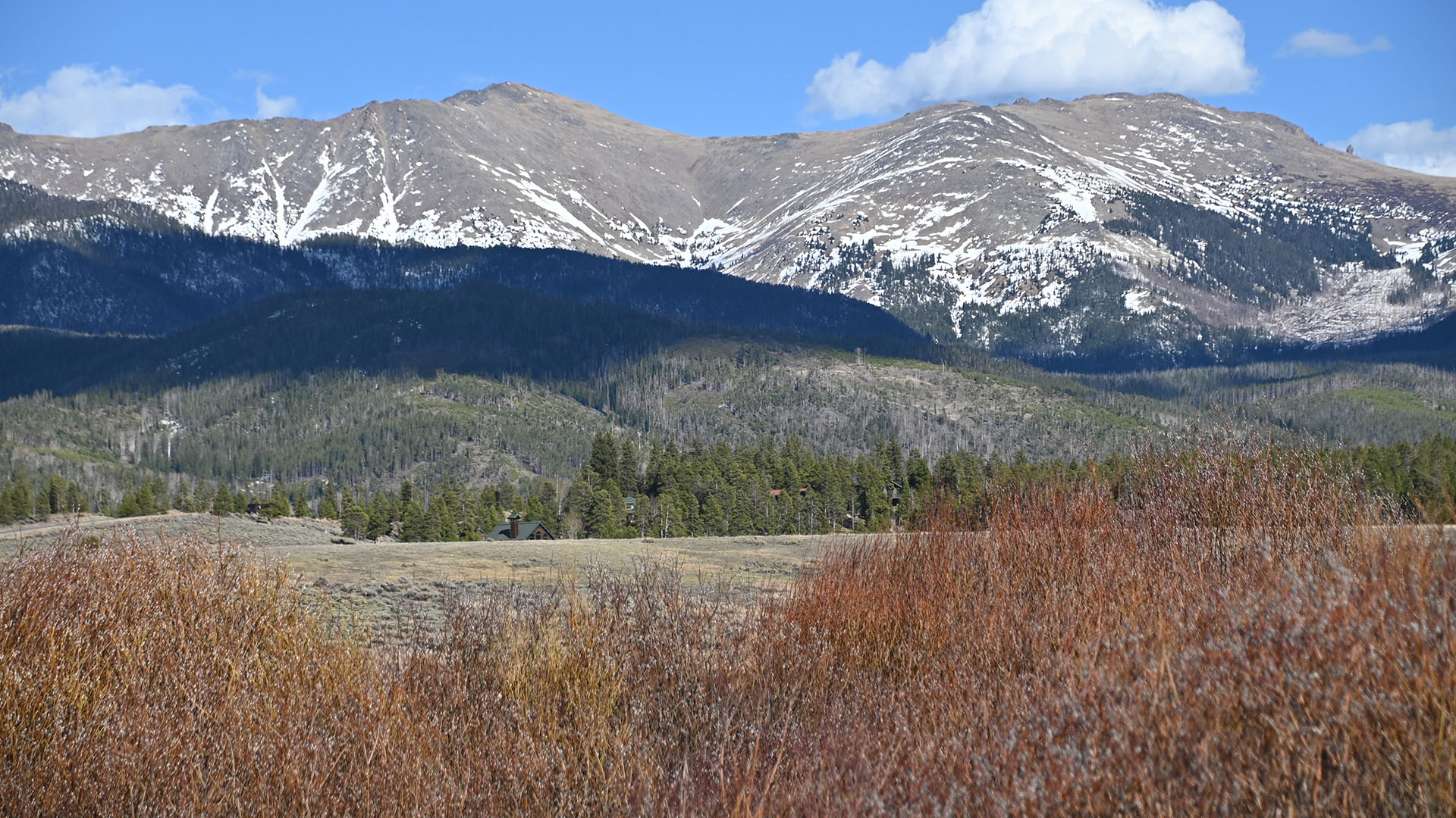 Mountains with very little snow on them.
