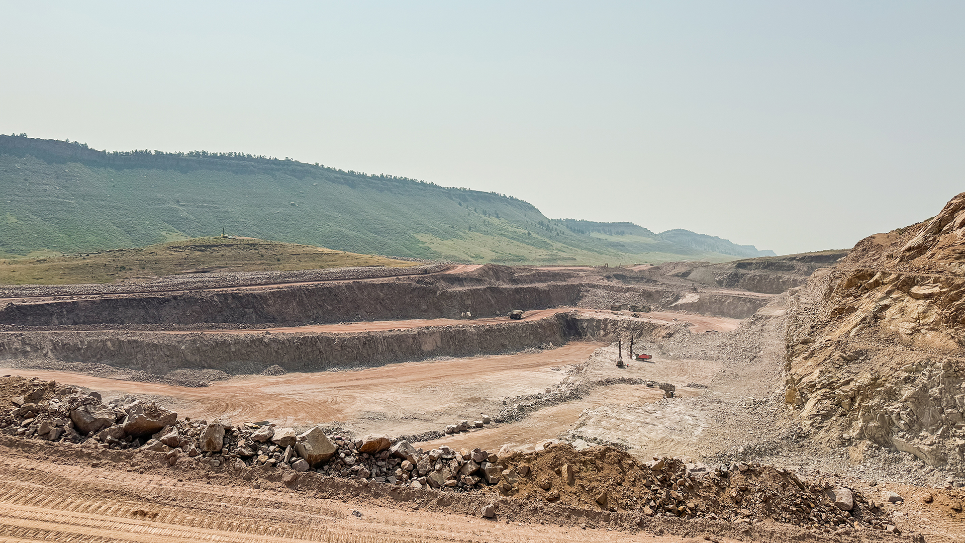 Quarry at Chimney Hollow Reservoir looking south with visible layers of rock