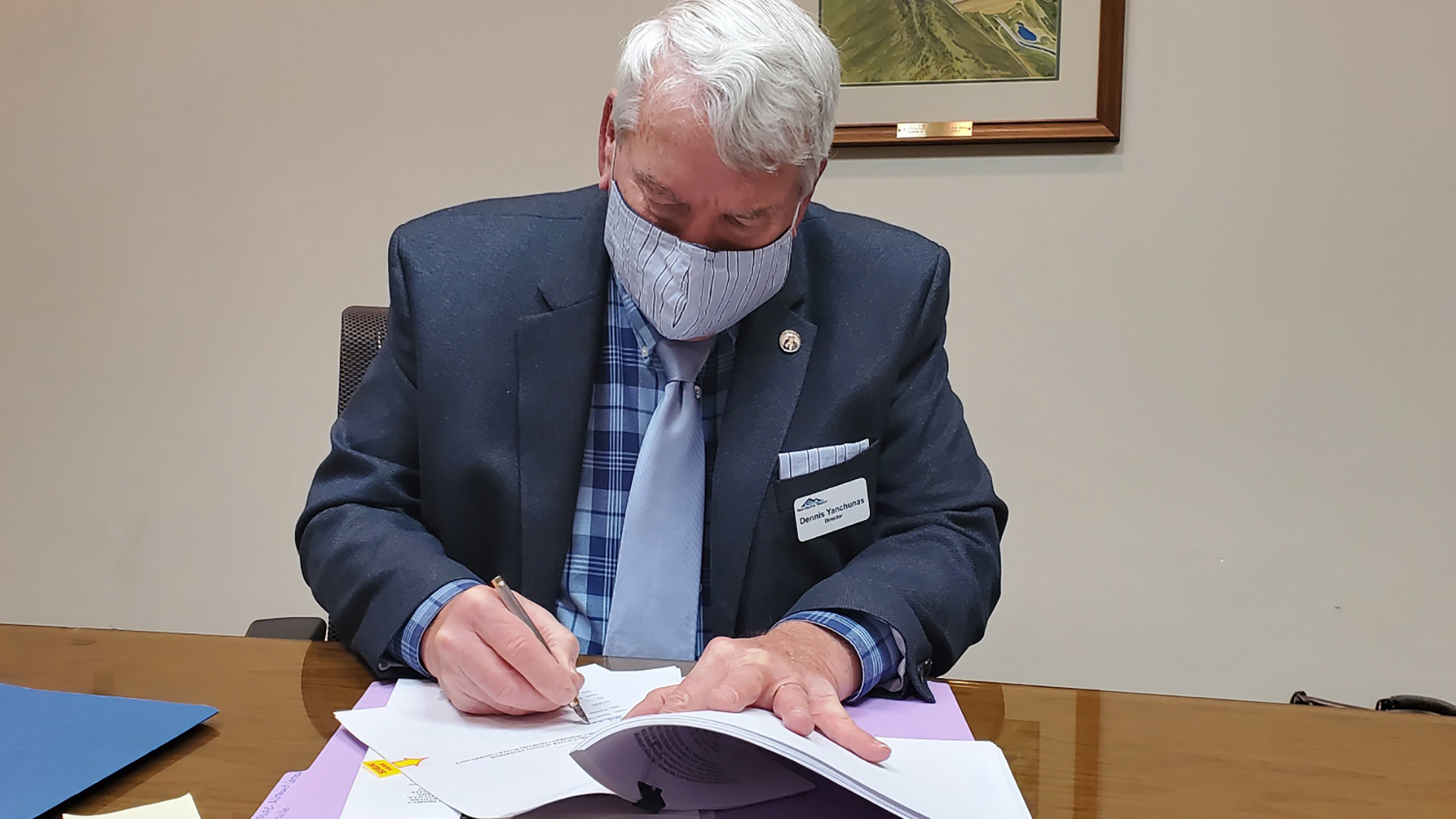 Municipal Subdistrict President Dennis Yanchunas signing a Windy Gap Firming Project document.
