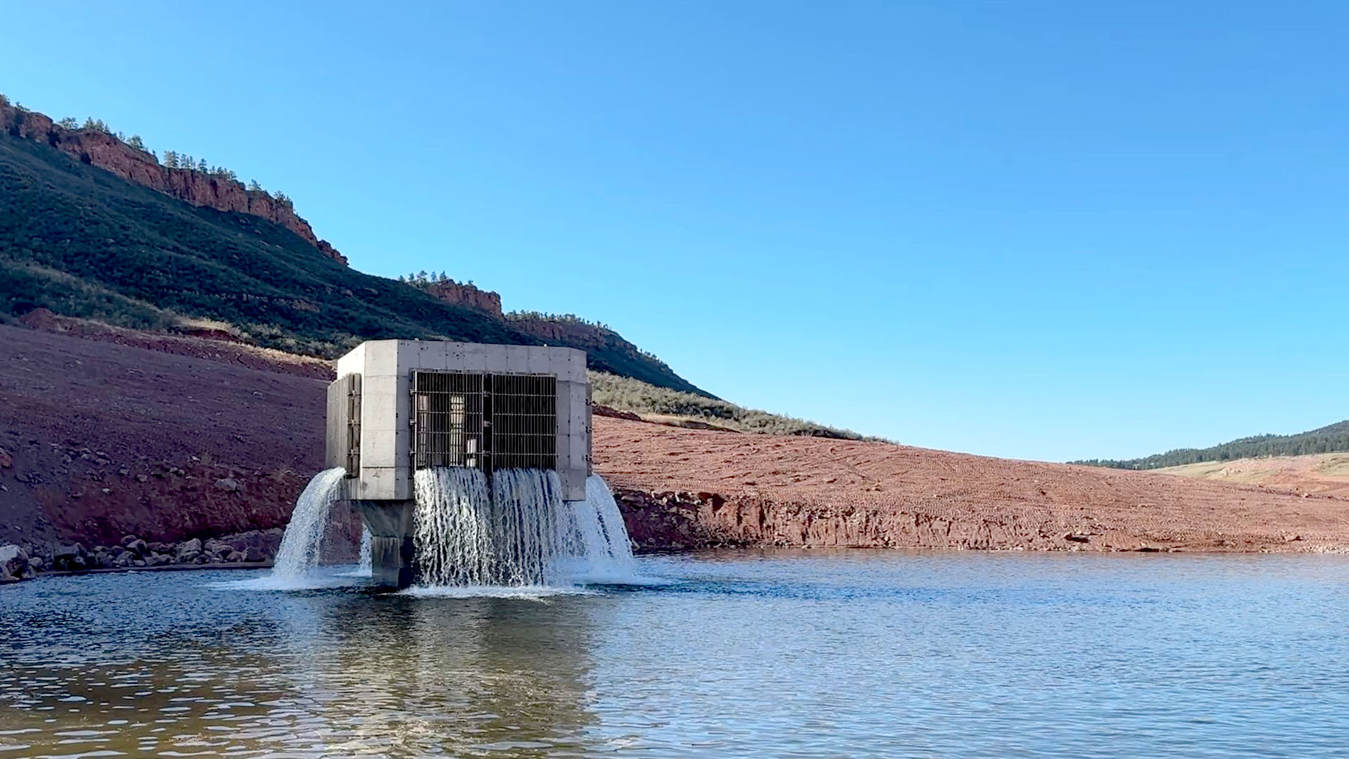 Water flowing from a tower into a larger pool.