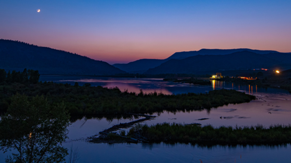 The moon rises over Windy Gap Reservoir in this image from 2020, before the reservoir was reconfigured to create the Colorado River Connectivity Channel.