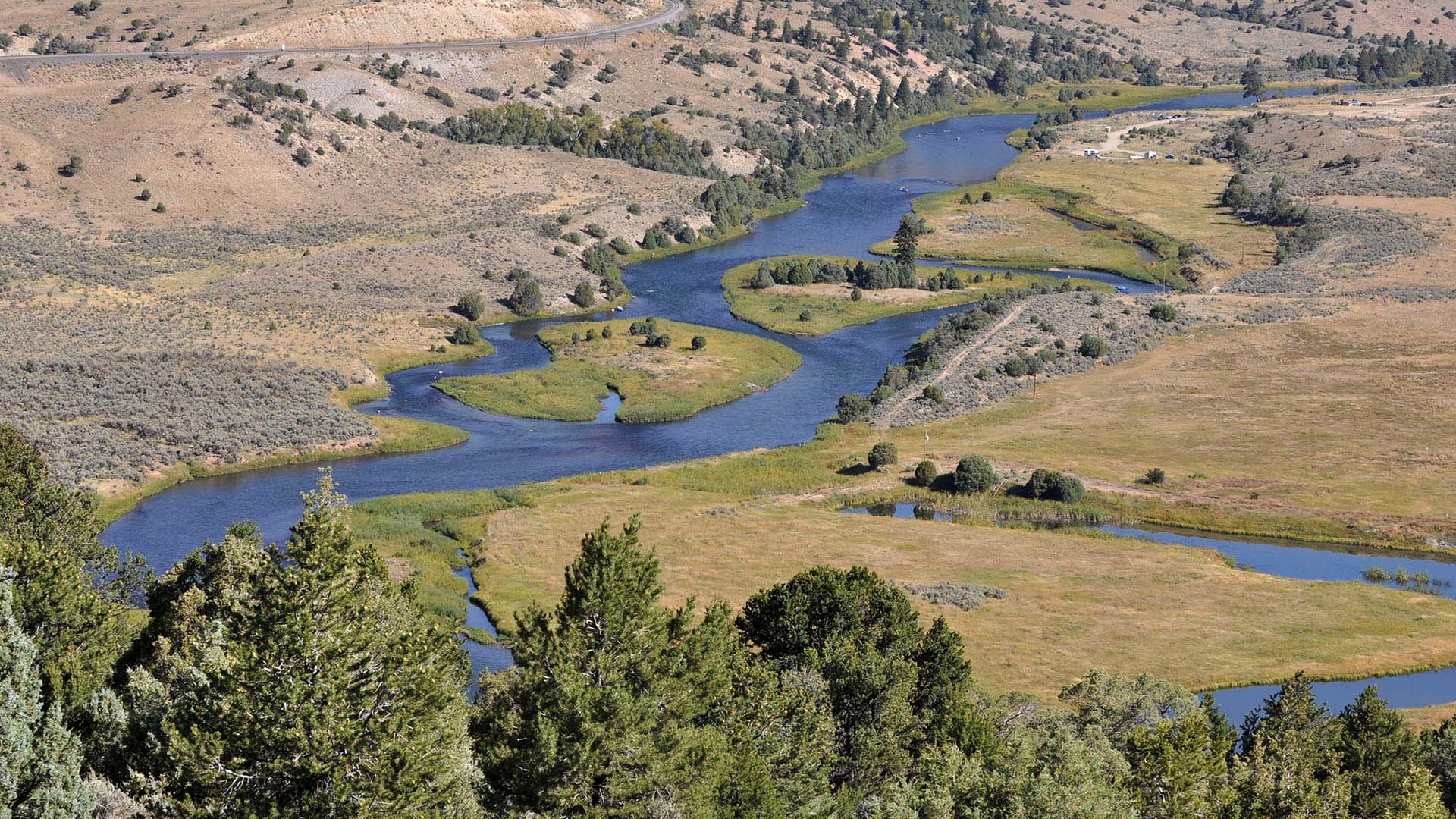 Aerial image of a river weaving through the land. 
